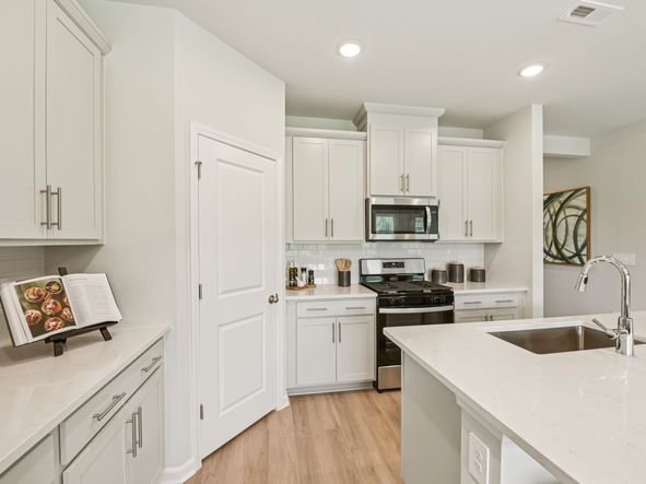 Kitchen in the Chatham floorplan at a Meritage Homes community in Mebane, NC.