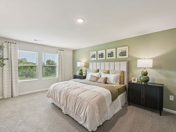 Primary bedroom in the Chatham floorplan at a Meritage Homes community in Mebane, NC.