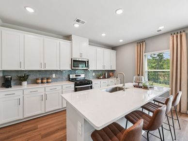 Kitchen in the Taylorsville floorplan at a Meritage Homes community in Mebane, NC.
