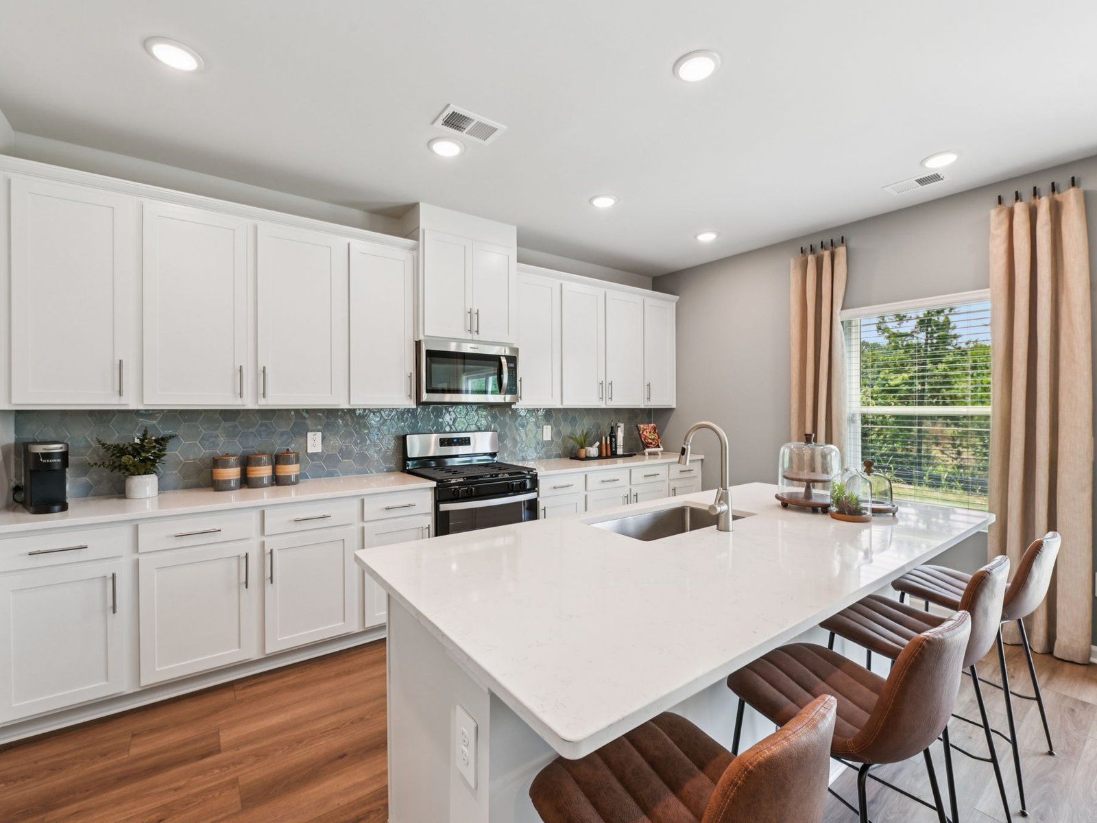 Kitchen in the Taylorsville floorplan at a Meritage Homes community in Mebane, NC.