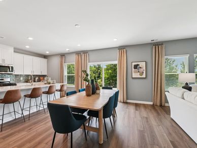 Dining area in the Taylorsville floorplan at a Meritage Homes community in Mebane, NC.