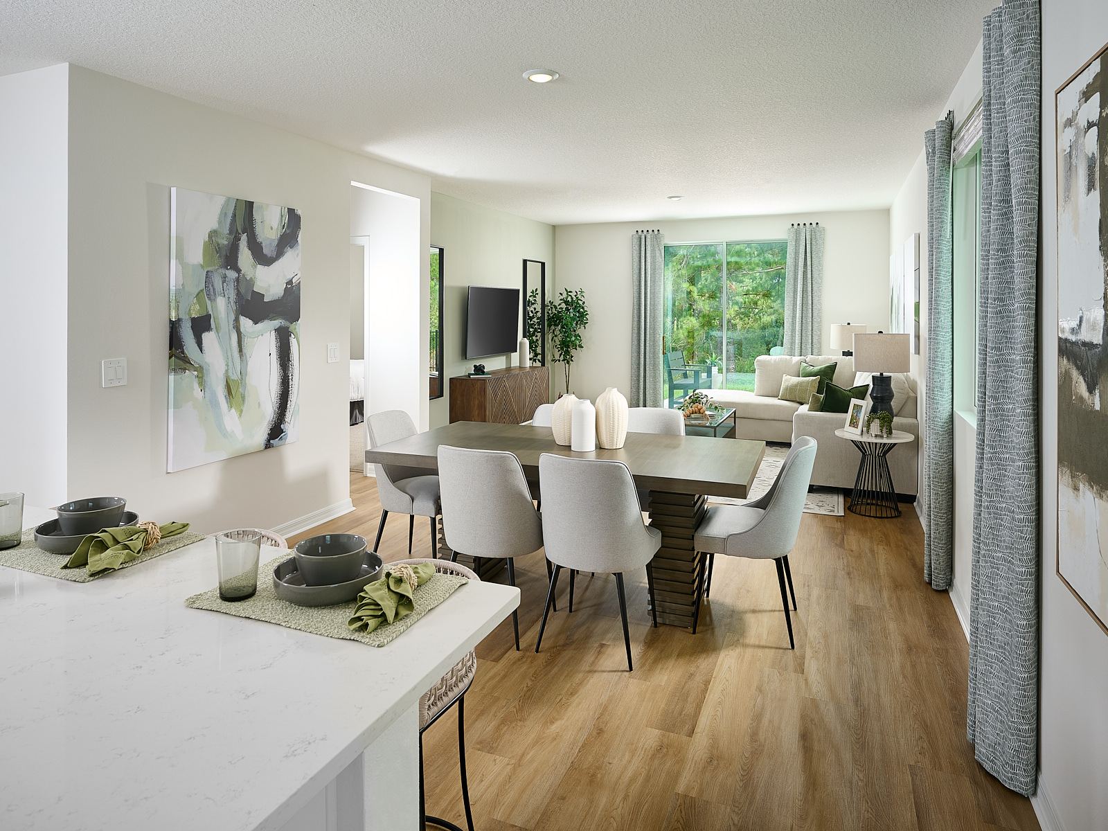 The Acadia Floorplan Great Room Modeled at Leyland Preserve.