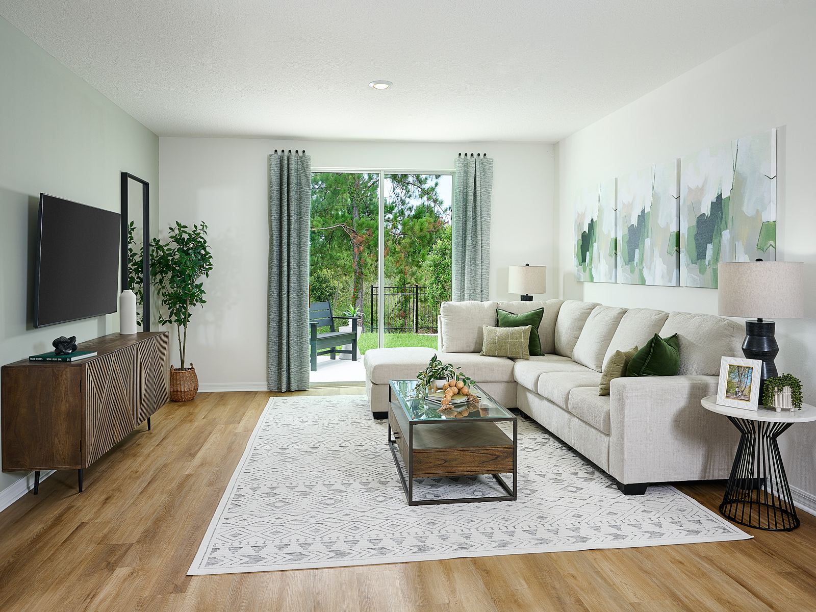 The Acadia Floorplan Living Room Modeled at Leyland Preserve.
