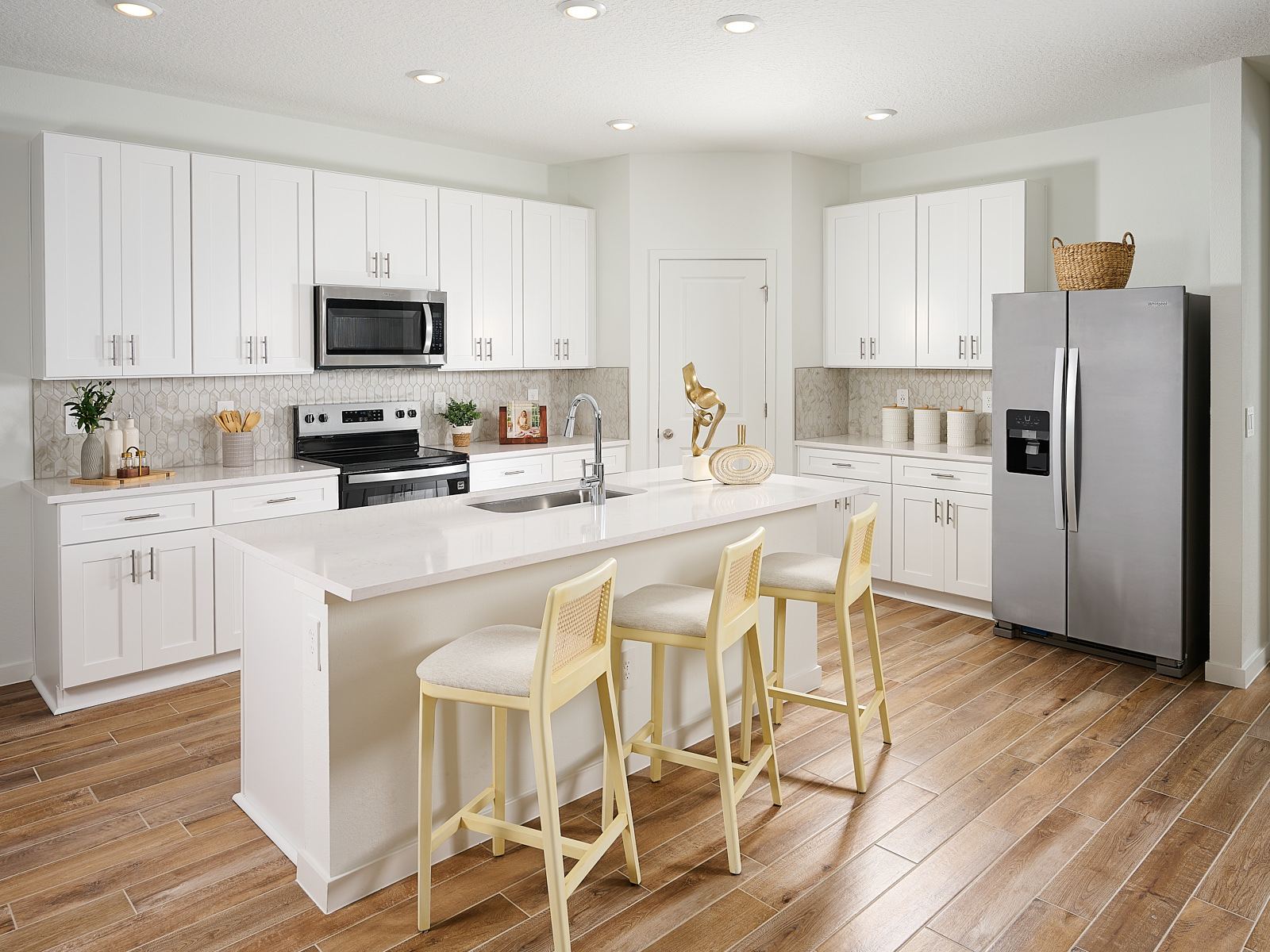 The Jasmine floorplan kitchen modeled at Azalea Creek.