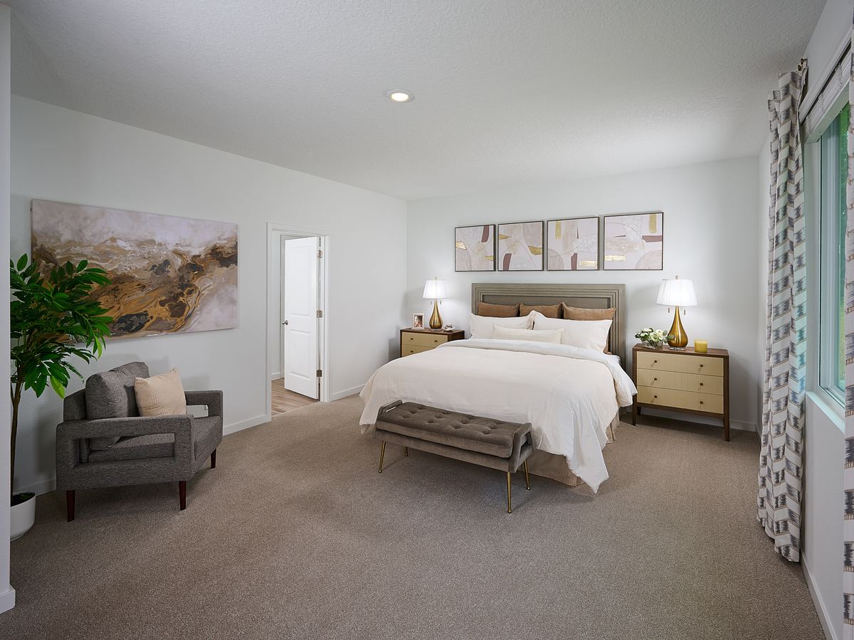 The Jasmine floorplan primary bedroom modeled at Azalea Creek.