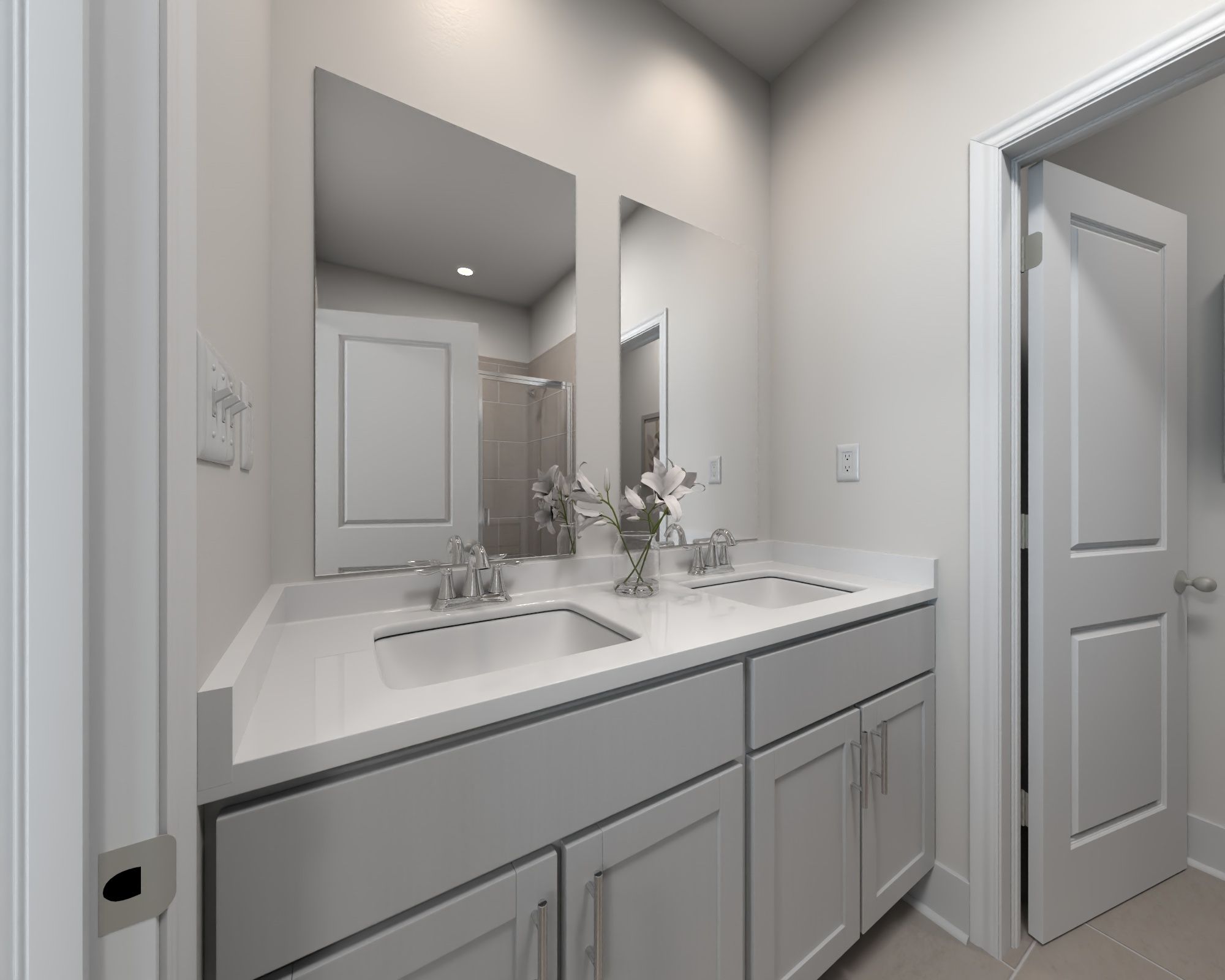 The primary bathroom offers dual vanity sinks and a walk-in shower.