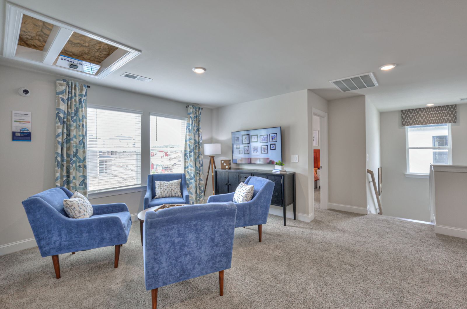 The upstairs loft separates the secondary bedrooms from the primary suite.
