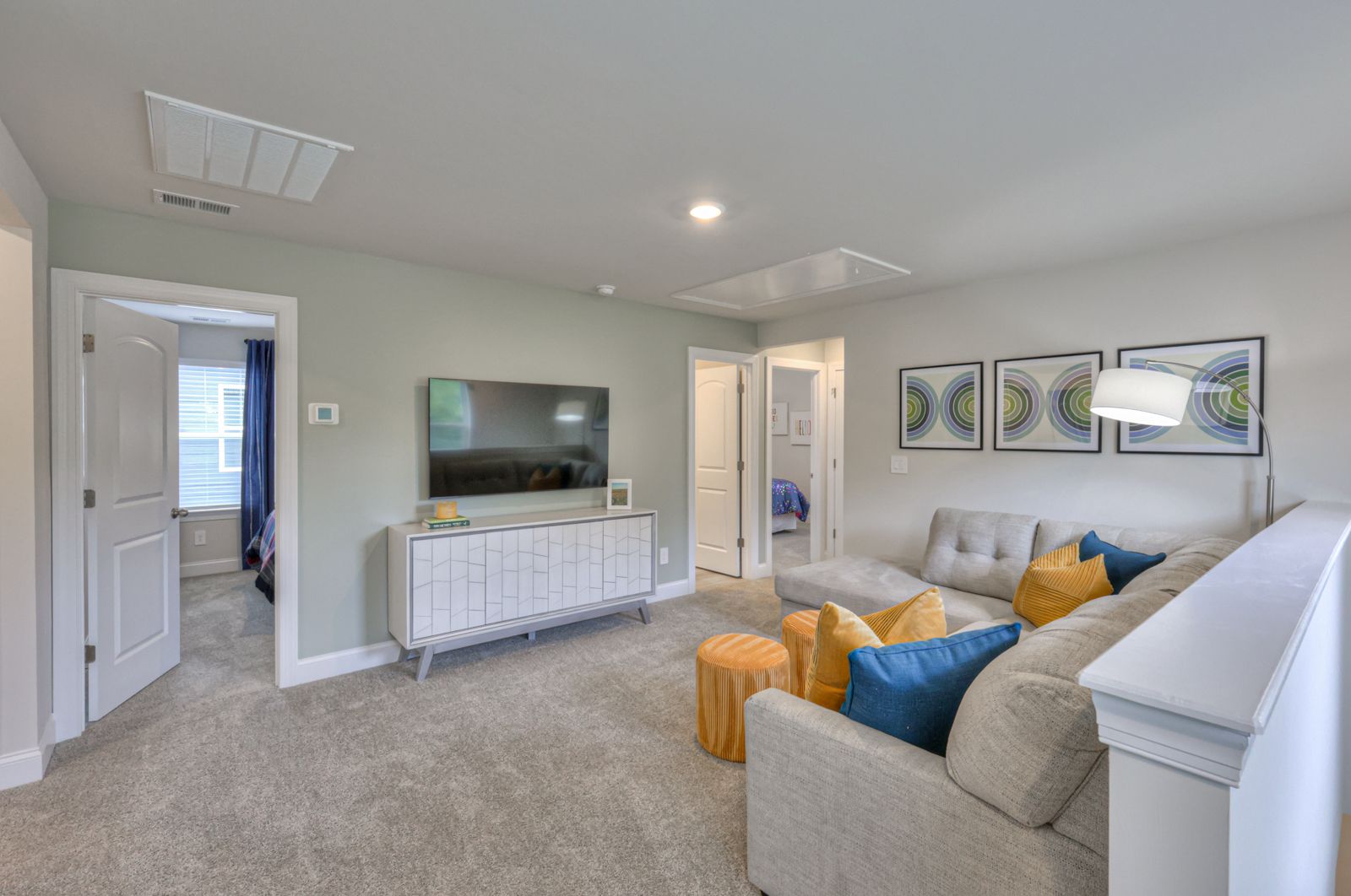 The upstairs loft separates the secondary bedrooms from the primary suite.