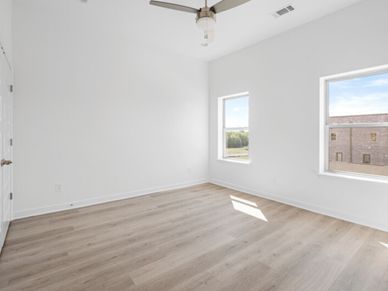 The secondary bedroom is ideal for guests, a home office, or a cozy retreat.