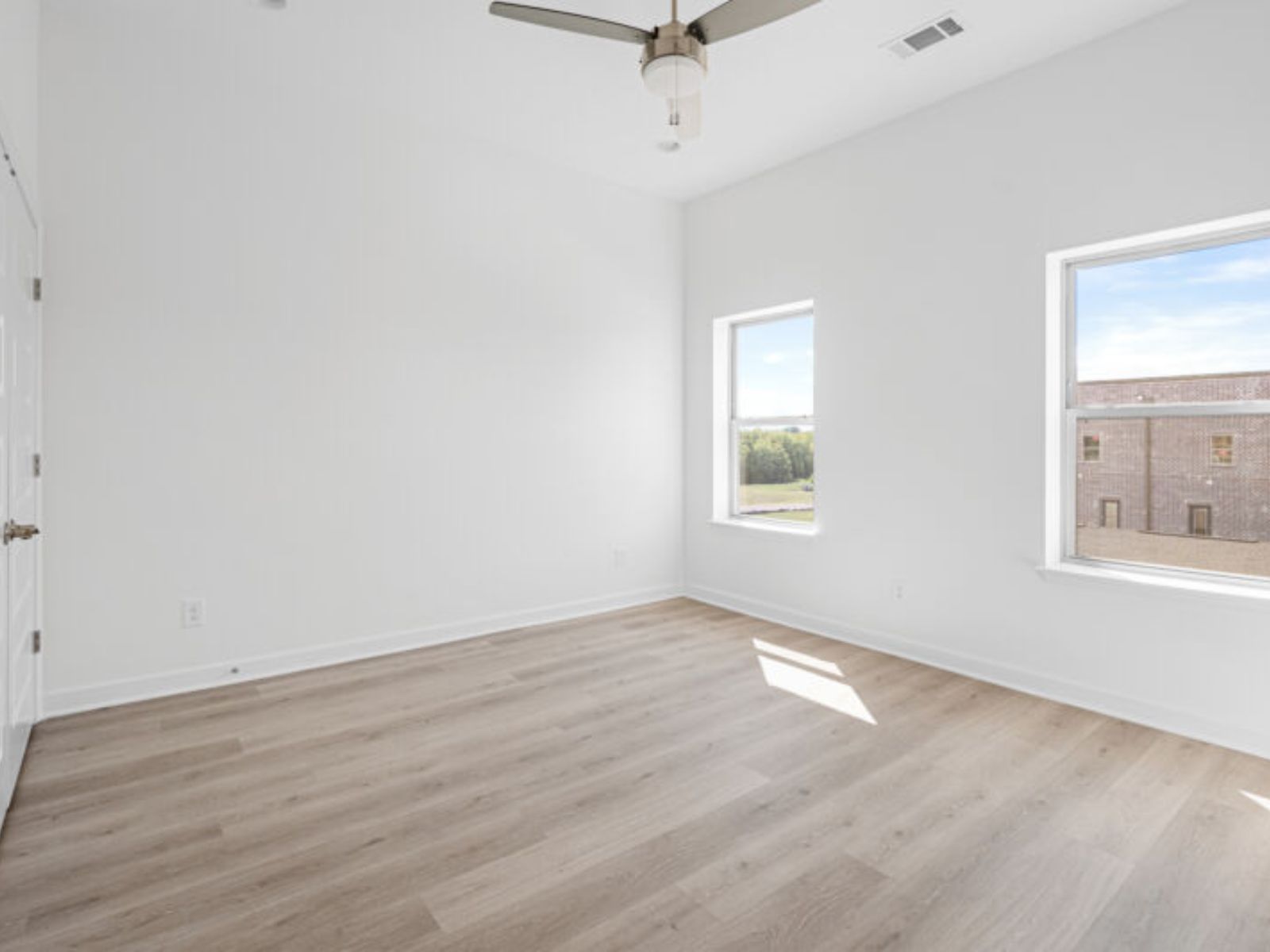 The secondary bedroom is ideal for guests, a home office, or a cozy retreat.