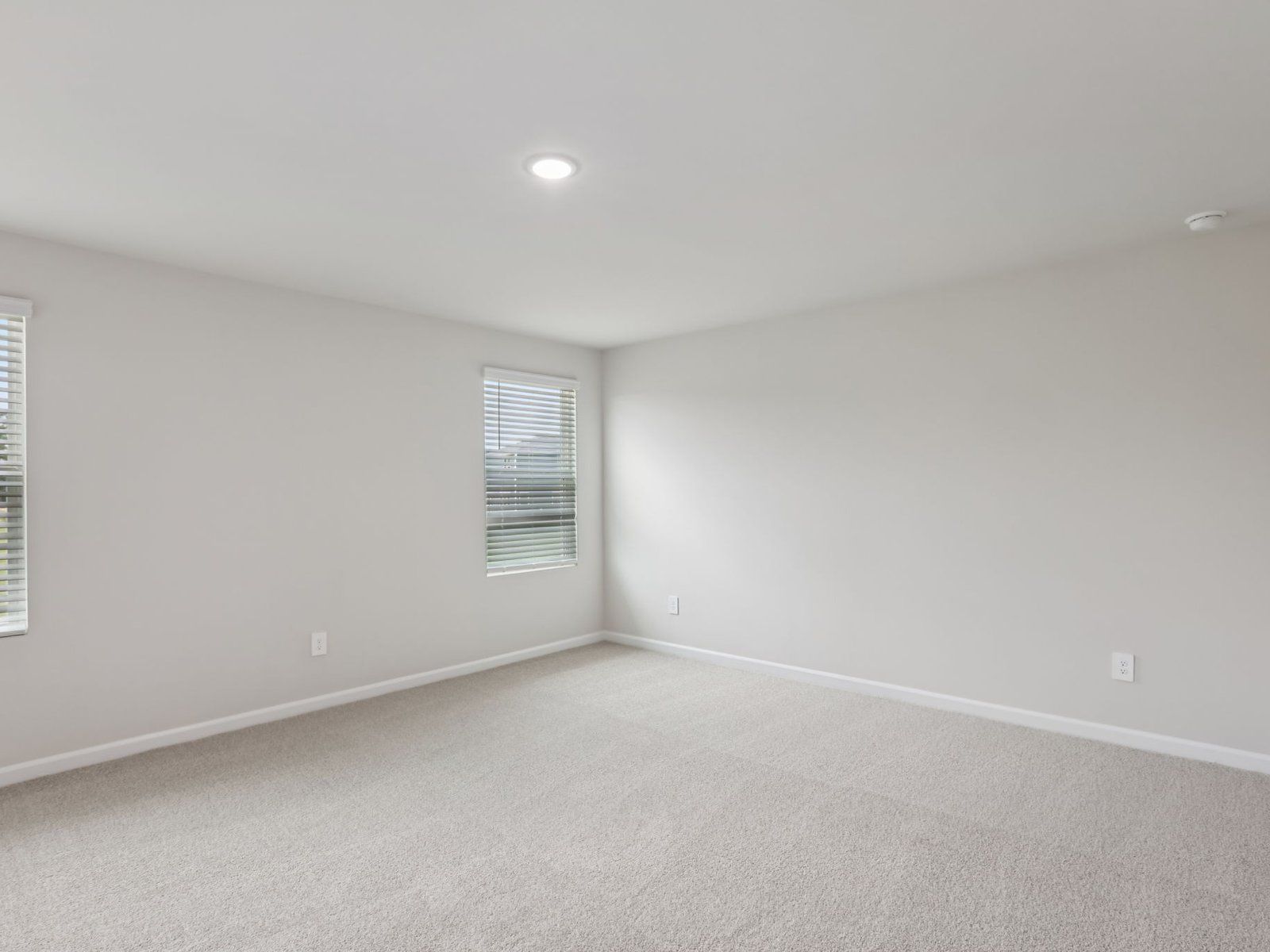 Primary bedroom in the Johnson floorplan at a Meritage Homes community in Angier, NC.