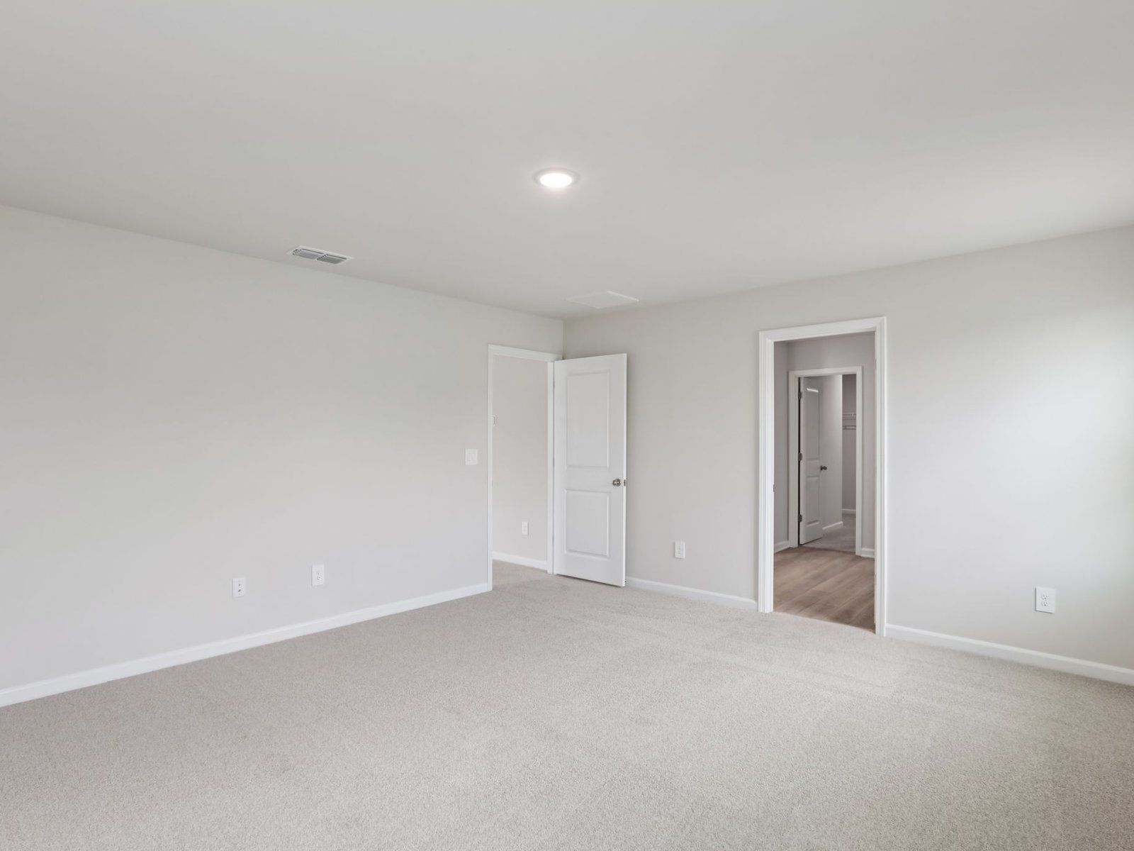 Primary bedroom in the Johnson floorplan at a Meritage Homes community in Angier, NC.
