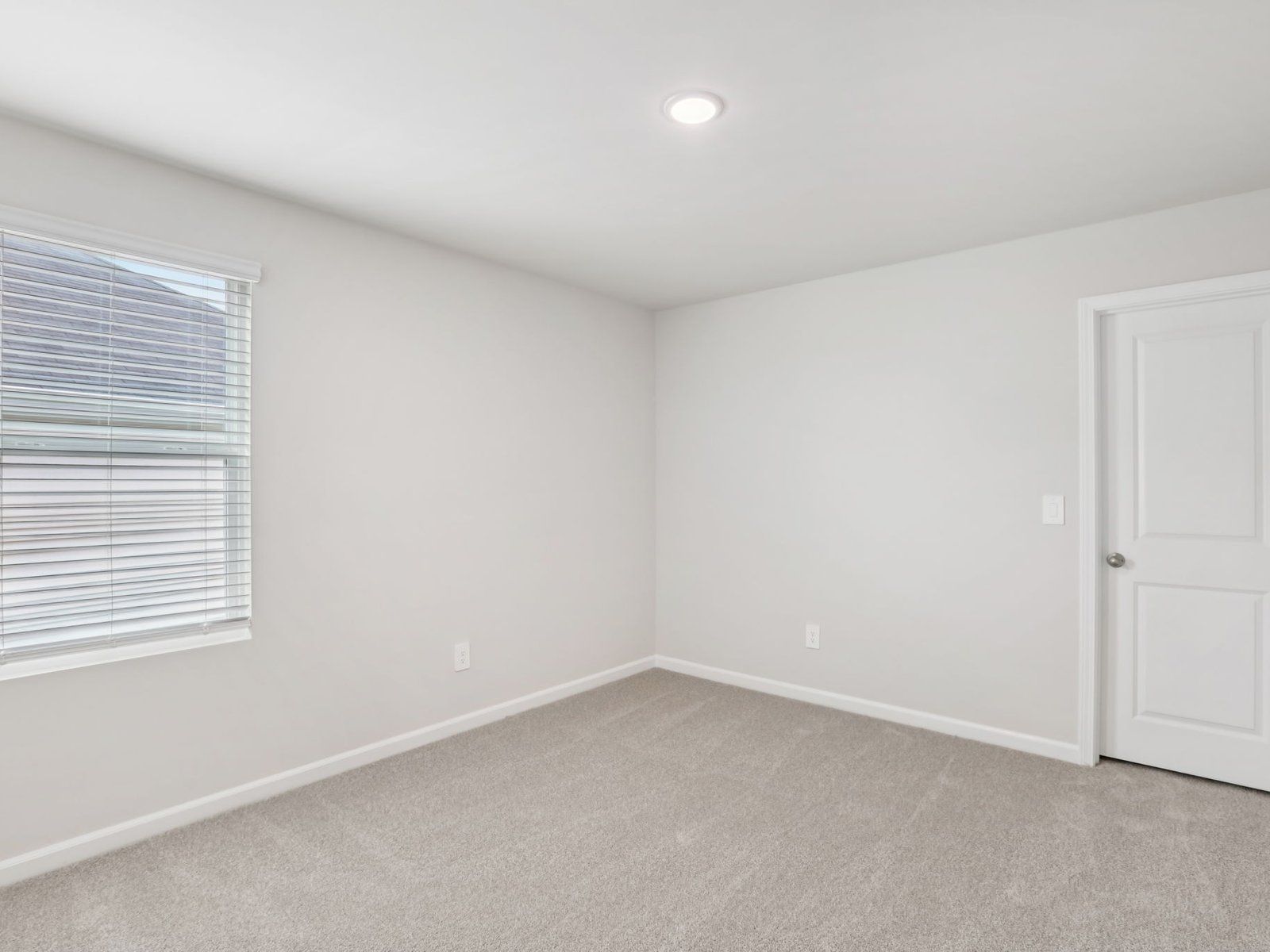 Secondary bedroom in the Johnson floorplan at a Meritage Homes community in Angier, NC.