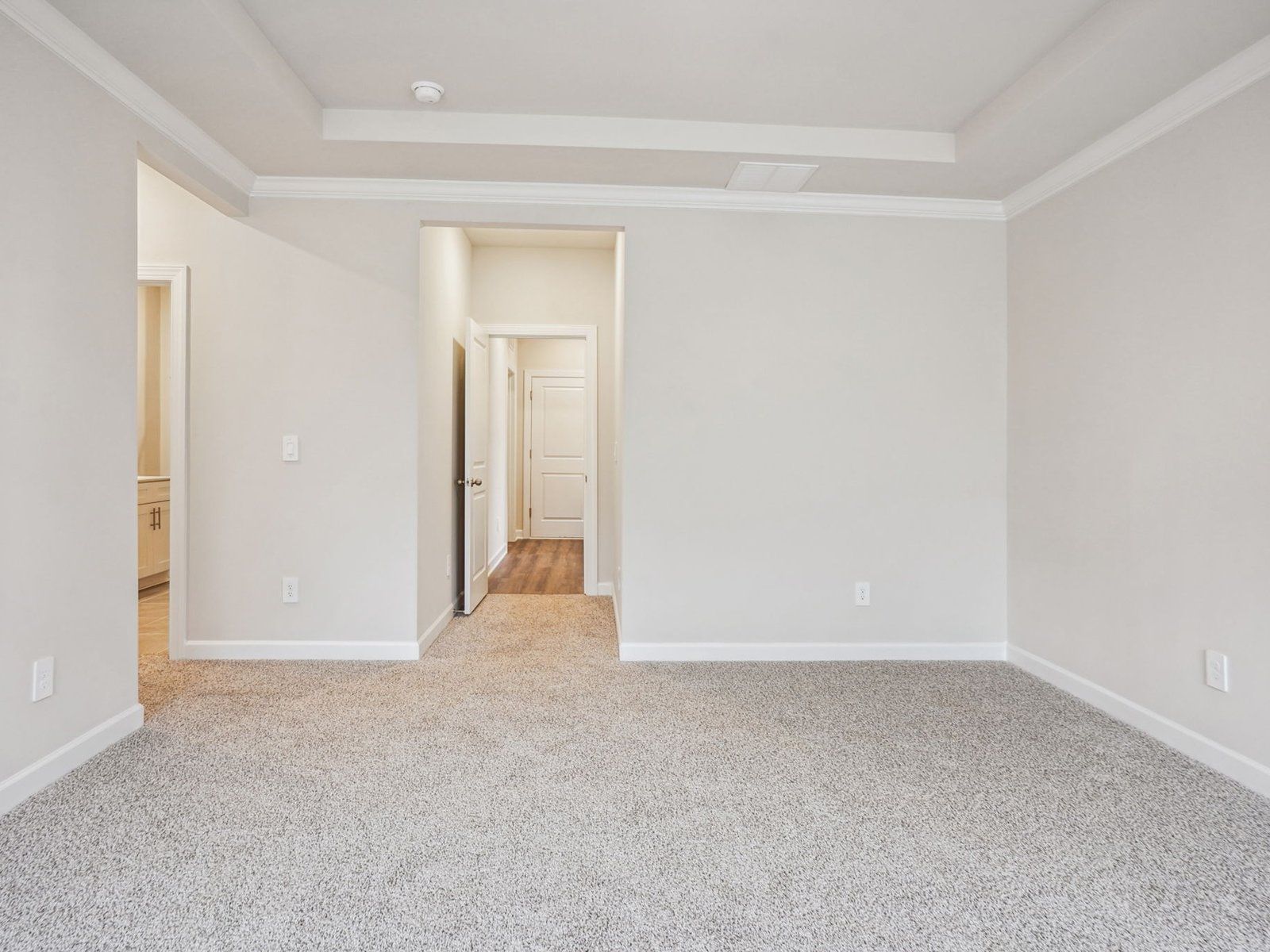 The primary bedroom is located on the first floor for easy access and privacy.