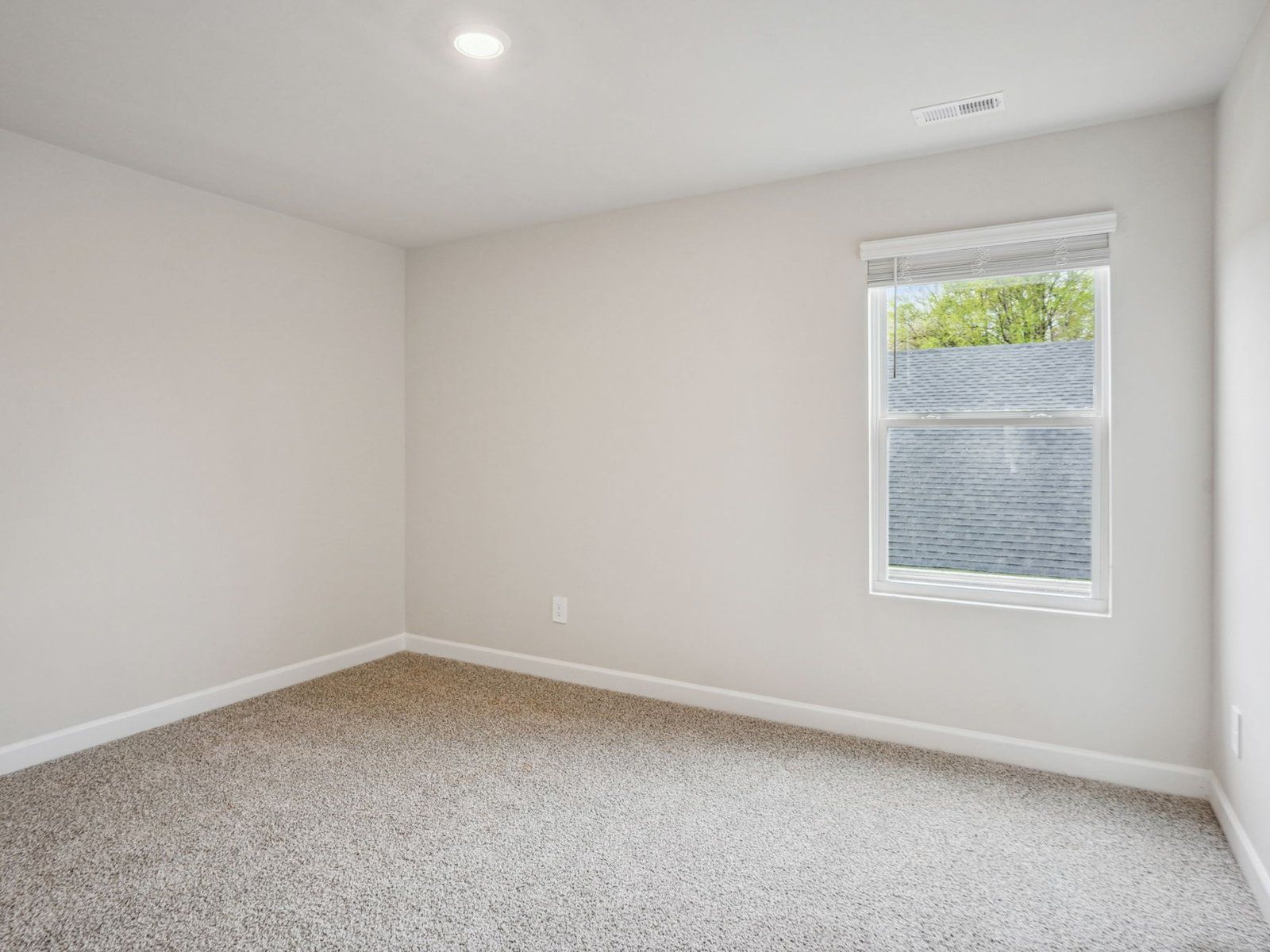 The secondary bedroom is perfect for guests or visitors.