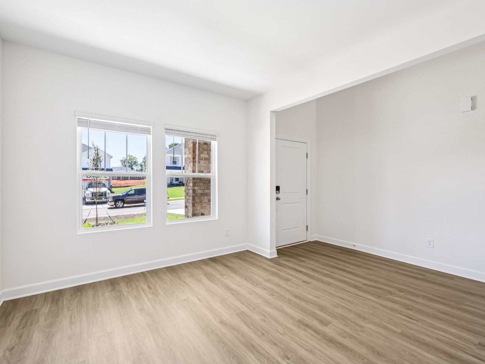 The flex room makes for a perfect entry seating area or home office.