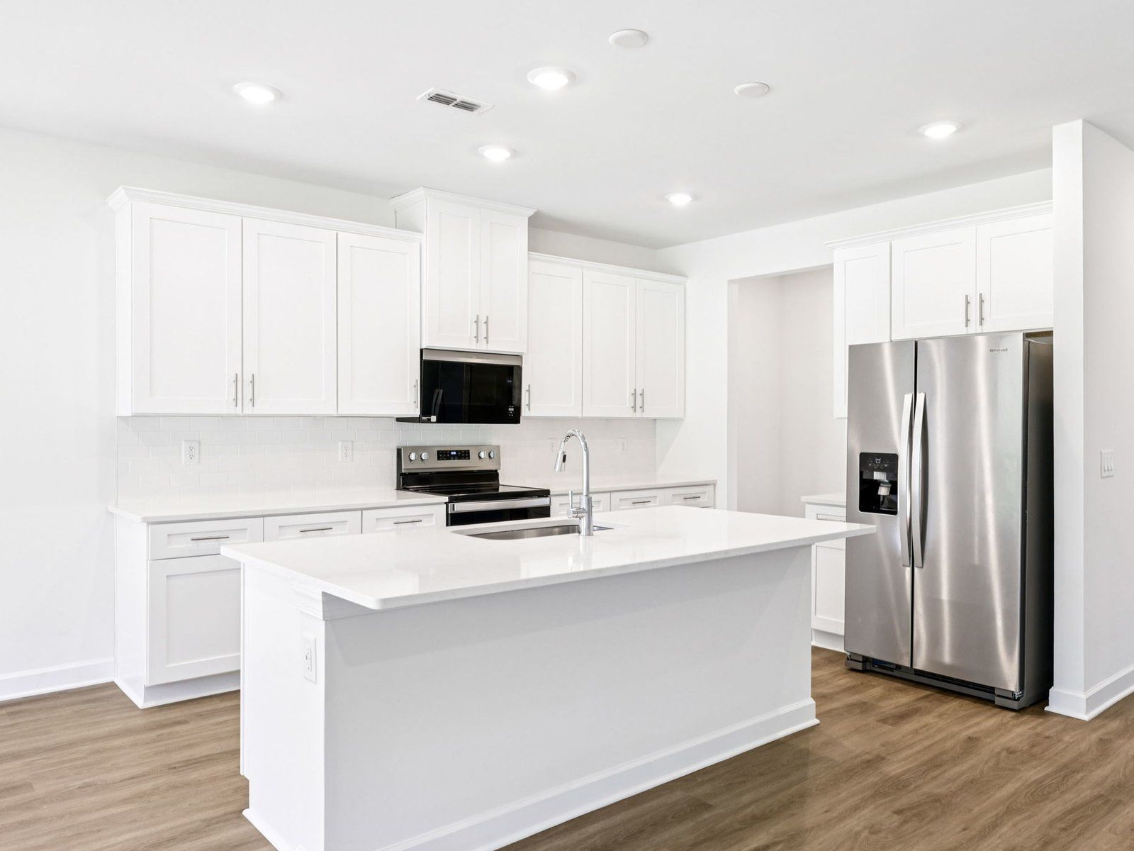 The kitchen island can be the perfect bar counter for additional seating.