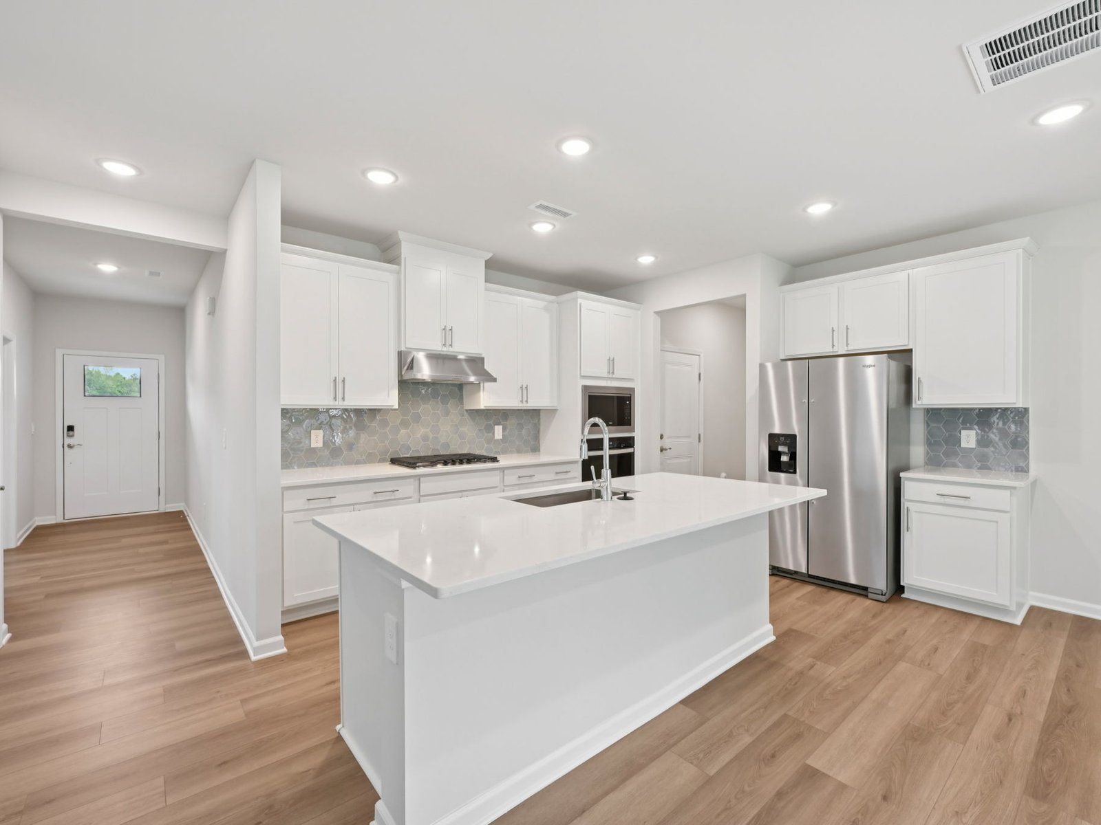 Kitchen in the Brentwood floorplan at a Meritage Homes community in Garner, NC.