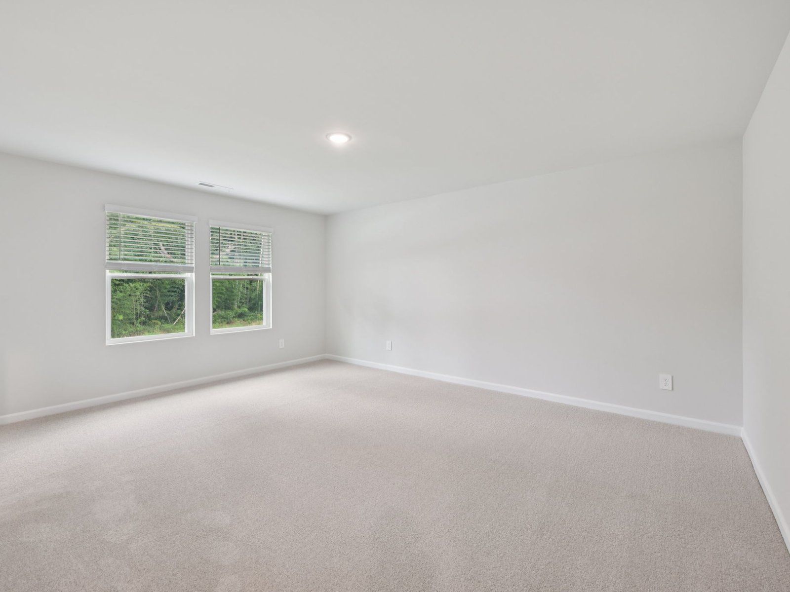 Primary bedroom in the Brentwood floorplan at a Meritage Homes community in Garner, NC.