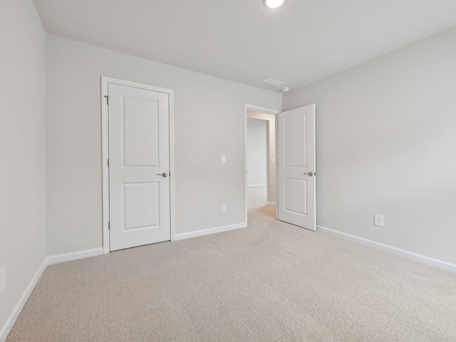Secondary bedroom in the Brentwood floorplan at a Meritage Homes community in Garner, NC.