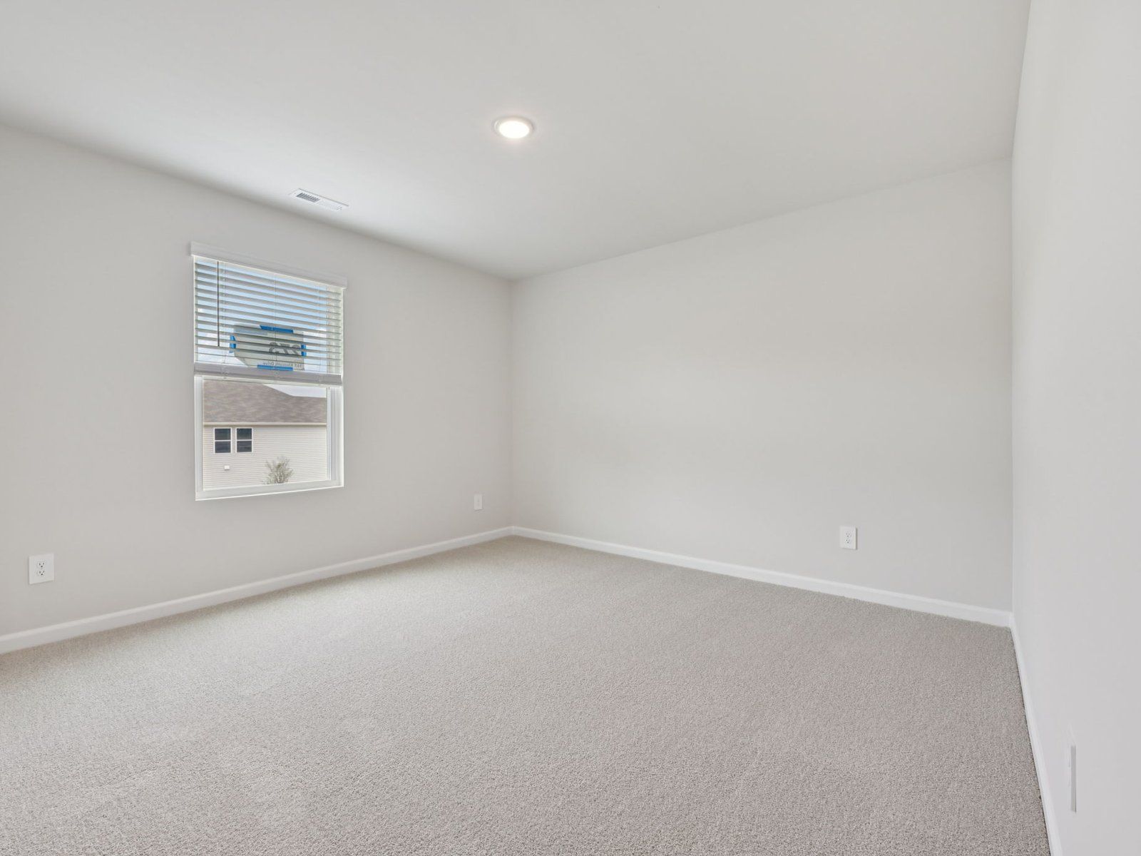 Secondary bedroom in the Brentwood floorplan at a Meritage Homes community in Garner, NC.