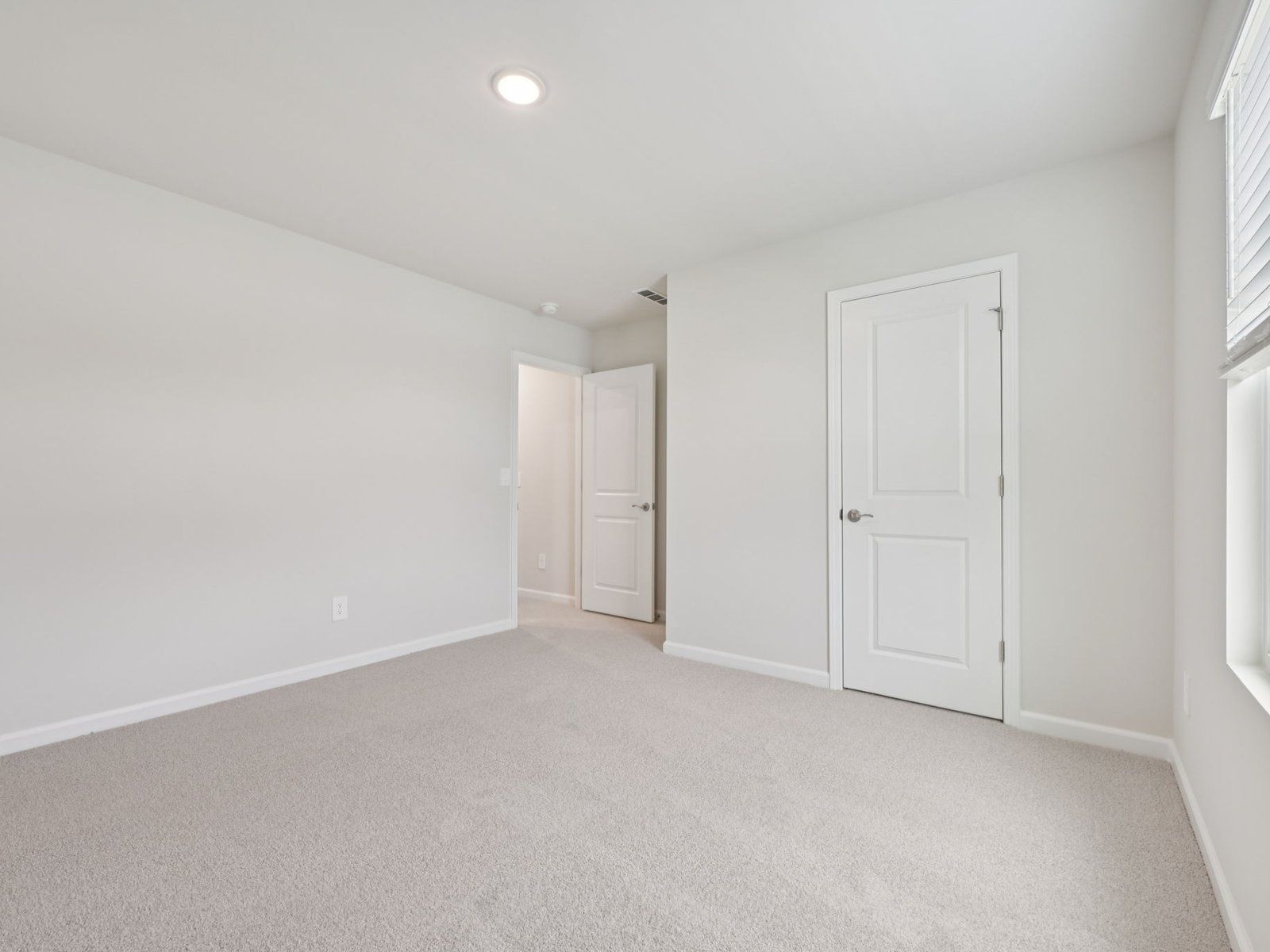 Secondary bedroom in the Brentwood floorplan at a Meritage Homes community in Garner, NC.