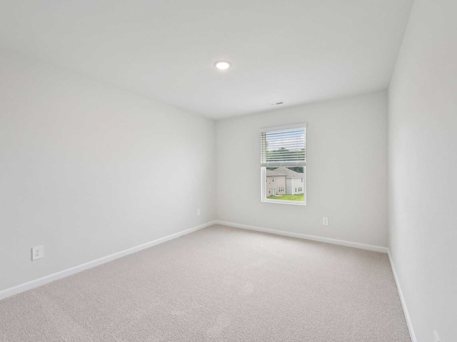 Secondary bedroom in the Brentwood floorplan at a Meritage Homes community in Garner, NC.