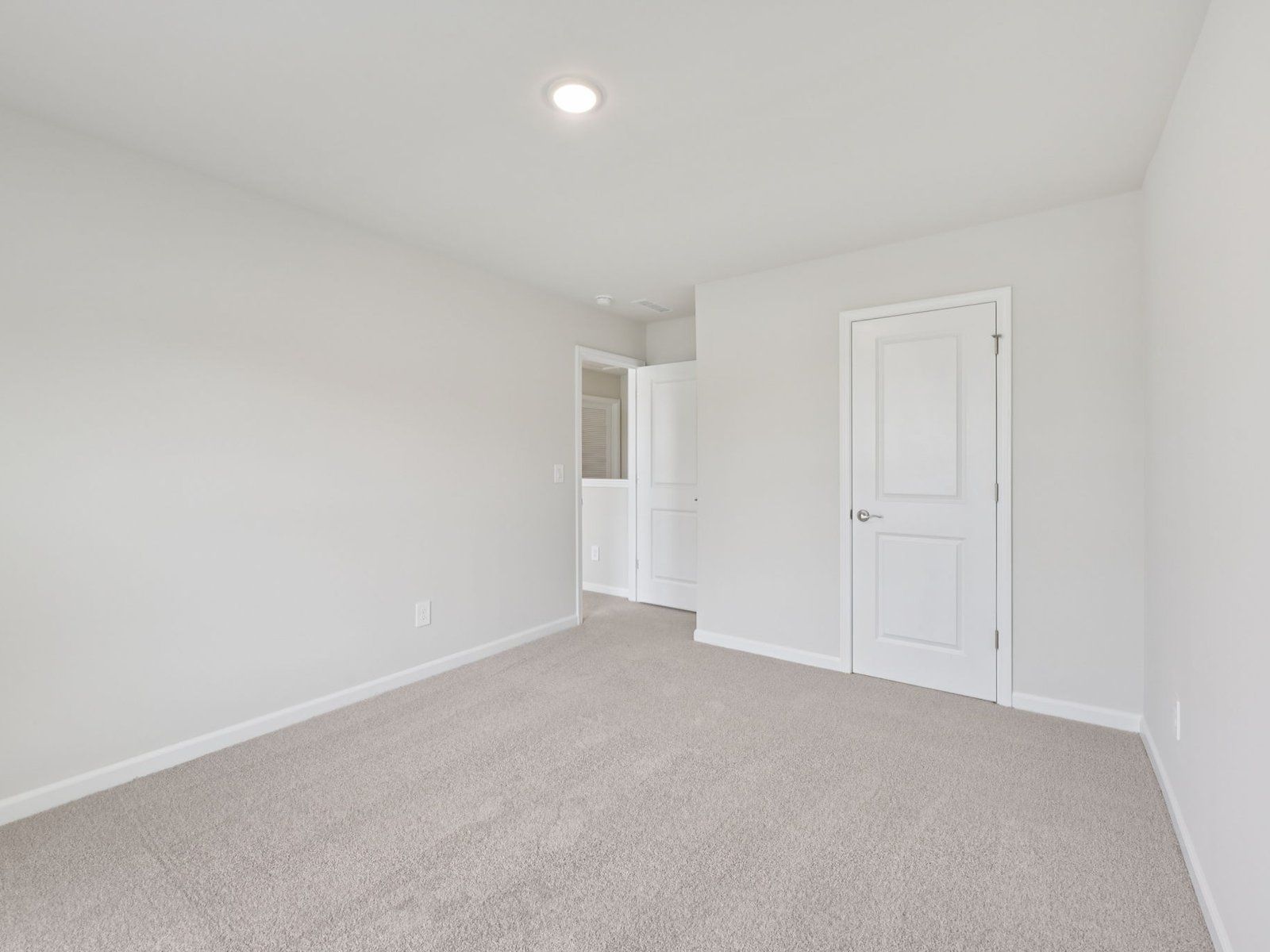 Secondary bedroom in the Brentwood floorplan at a Meritage Homes community in Garner, NC.