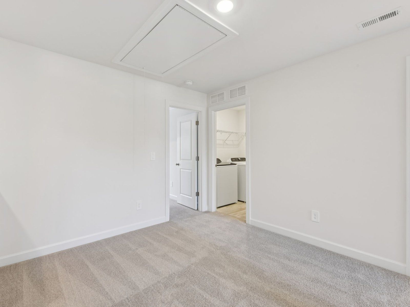 The loft provides a functional office or lounge space.