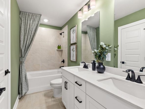 The Jordan floorplan features two secondary bathrooms and one half bathroom.