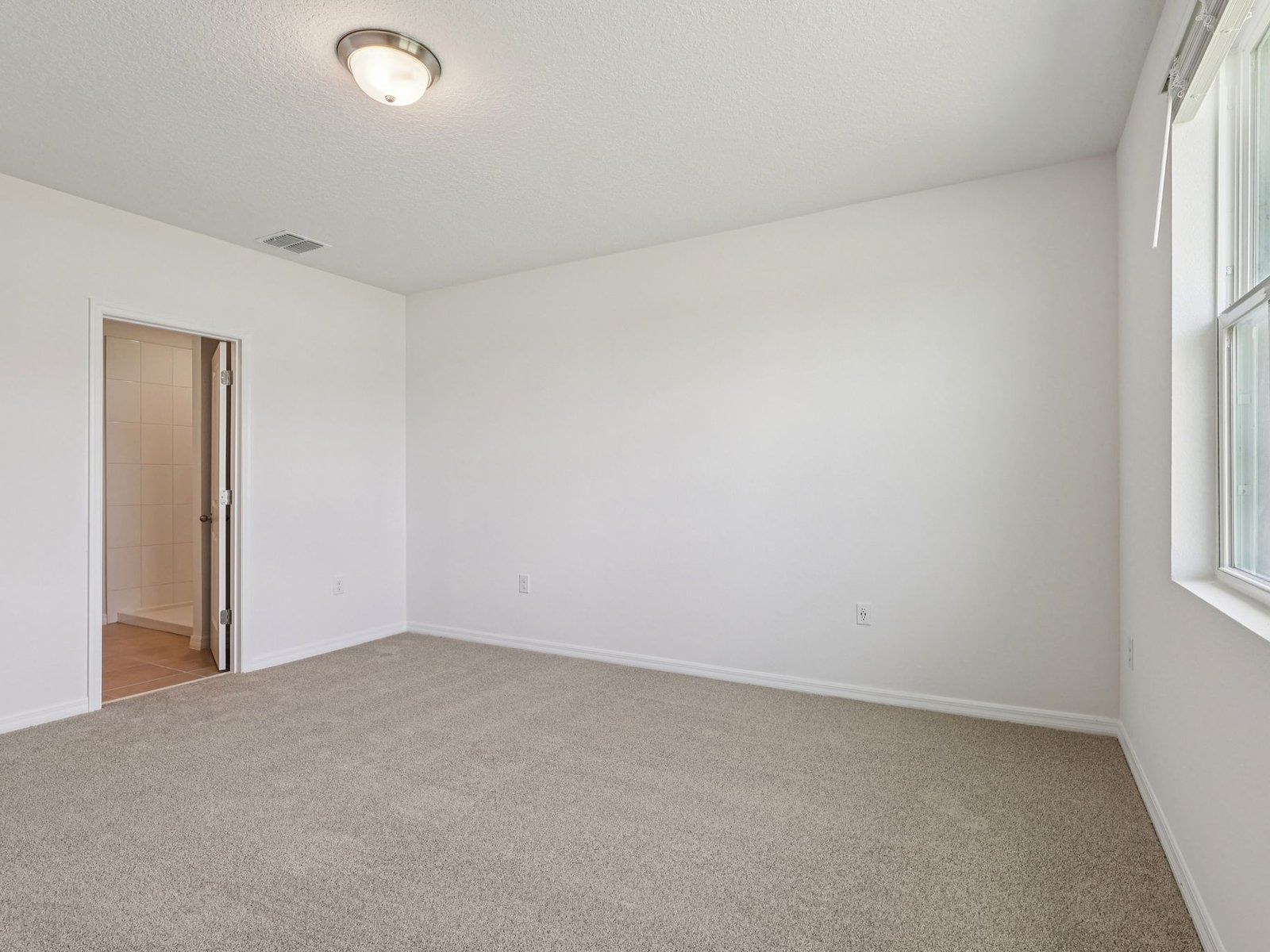 The Primary Bedroom of the Hibiscus Floorplan.
