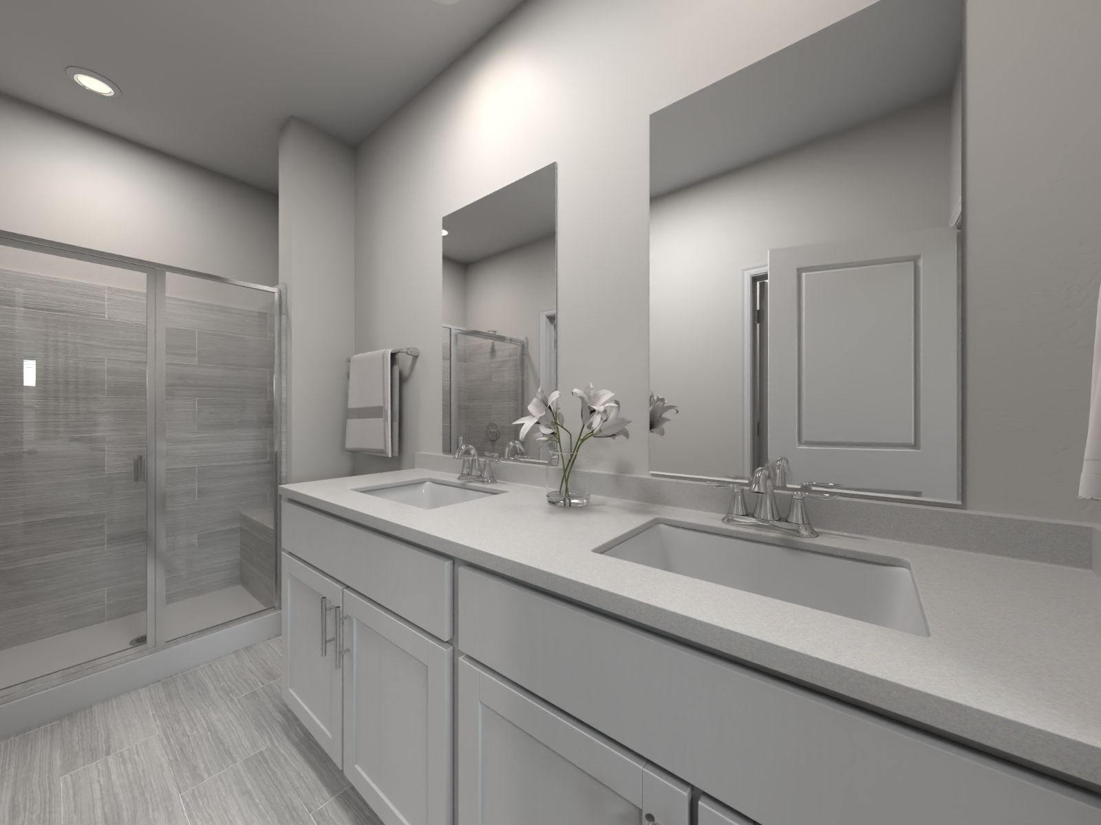 The primary bathroom boasts a dual-sink vanity and spacious walk-in shower.