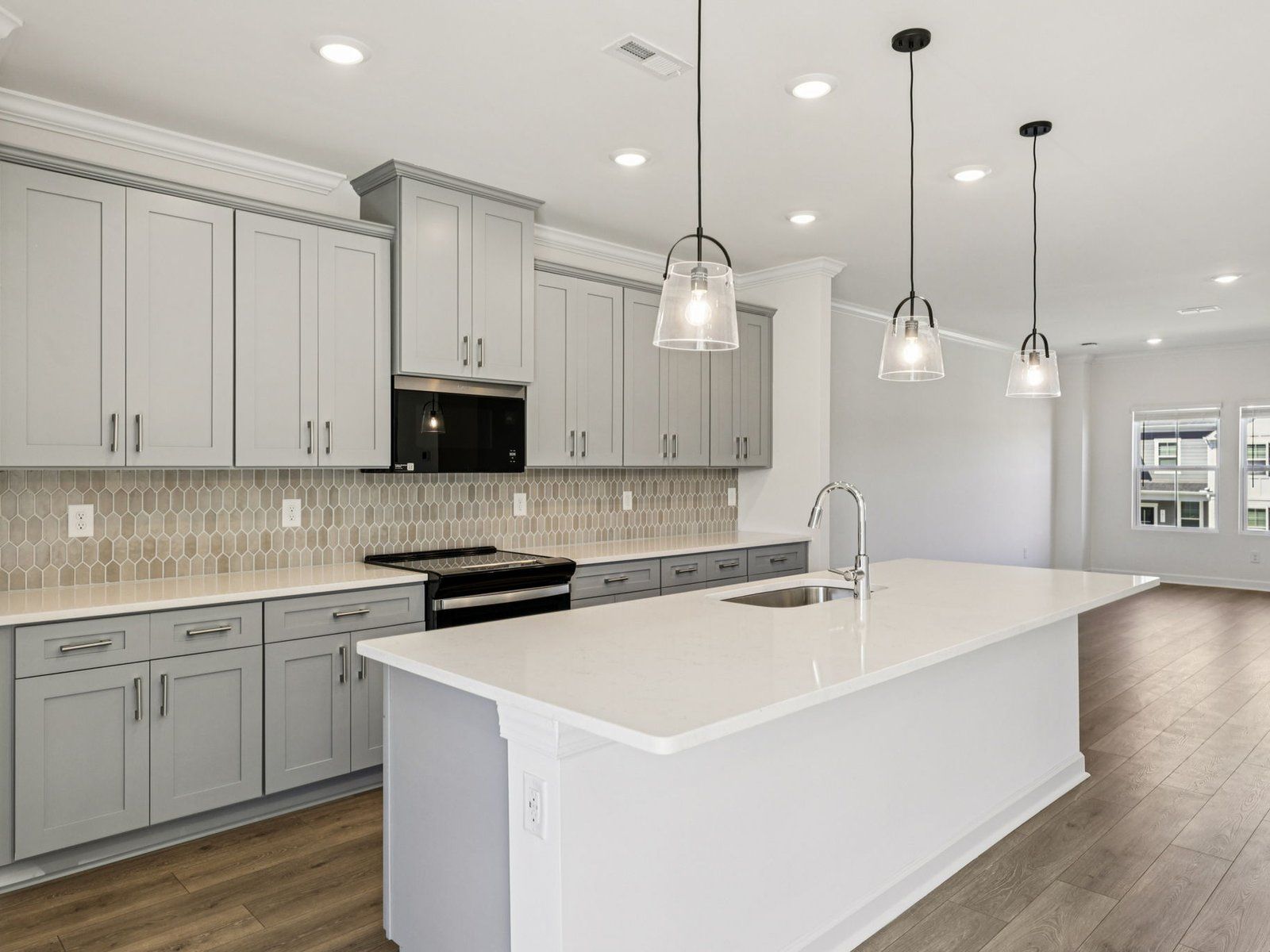 Turn the oversized kitchen island into a functional bar counter.