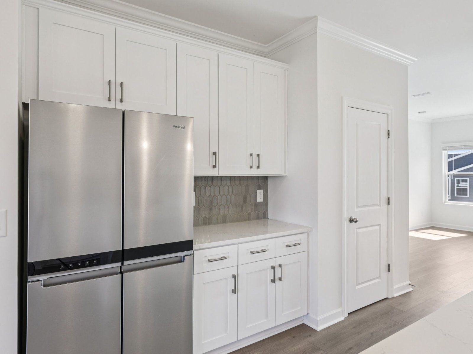 The kitchen includes countless cabinets for your cooking essentials.
