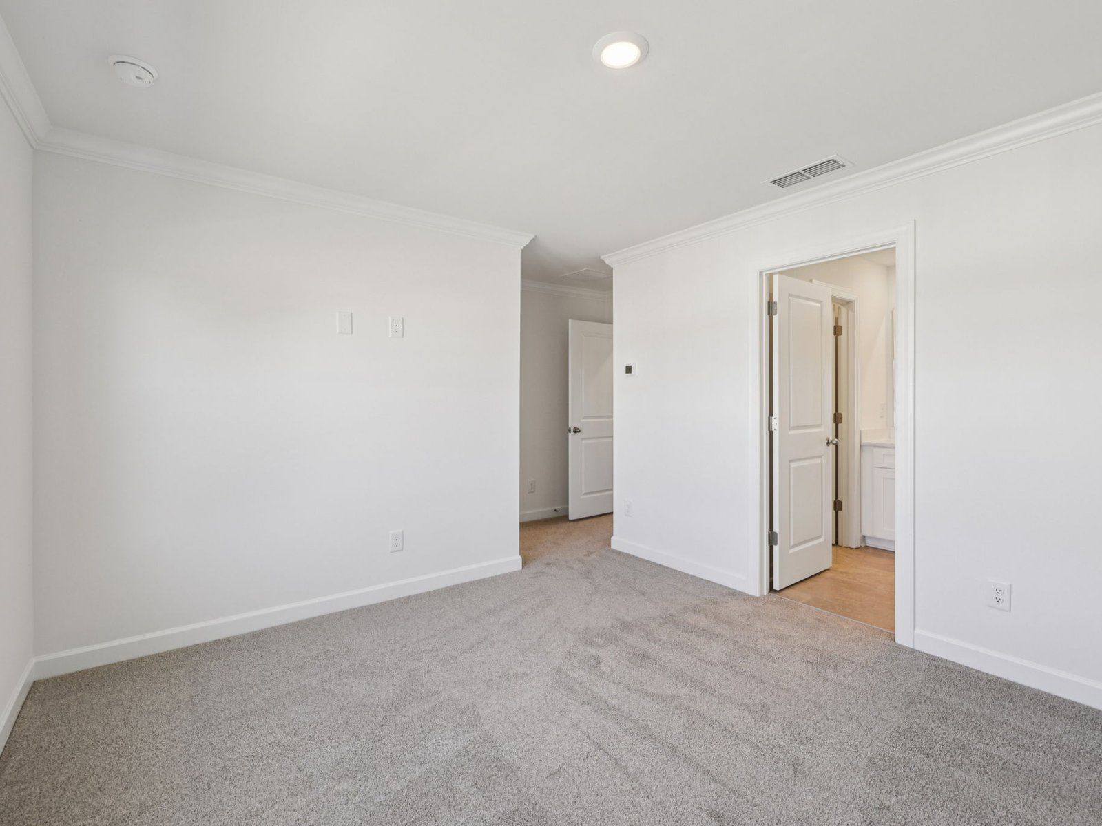 The primary bedroom leads to your own personal ensuite.