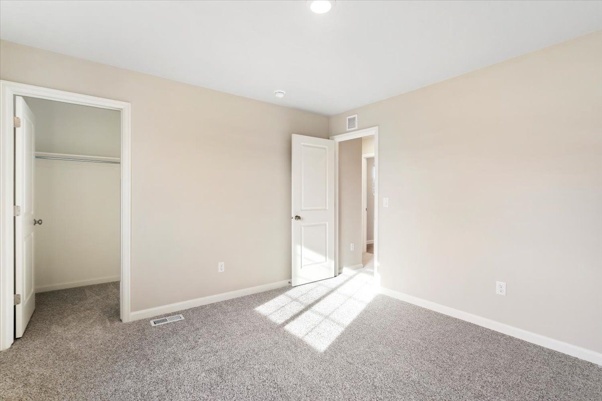 A view of the Third bedroom and hallway entrance