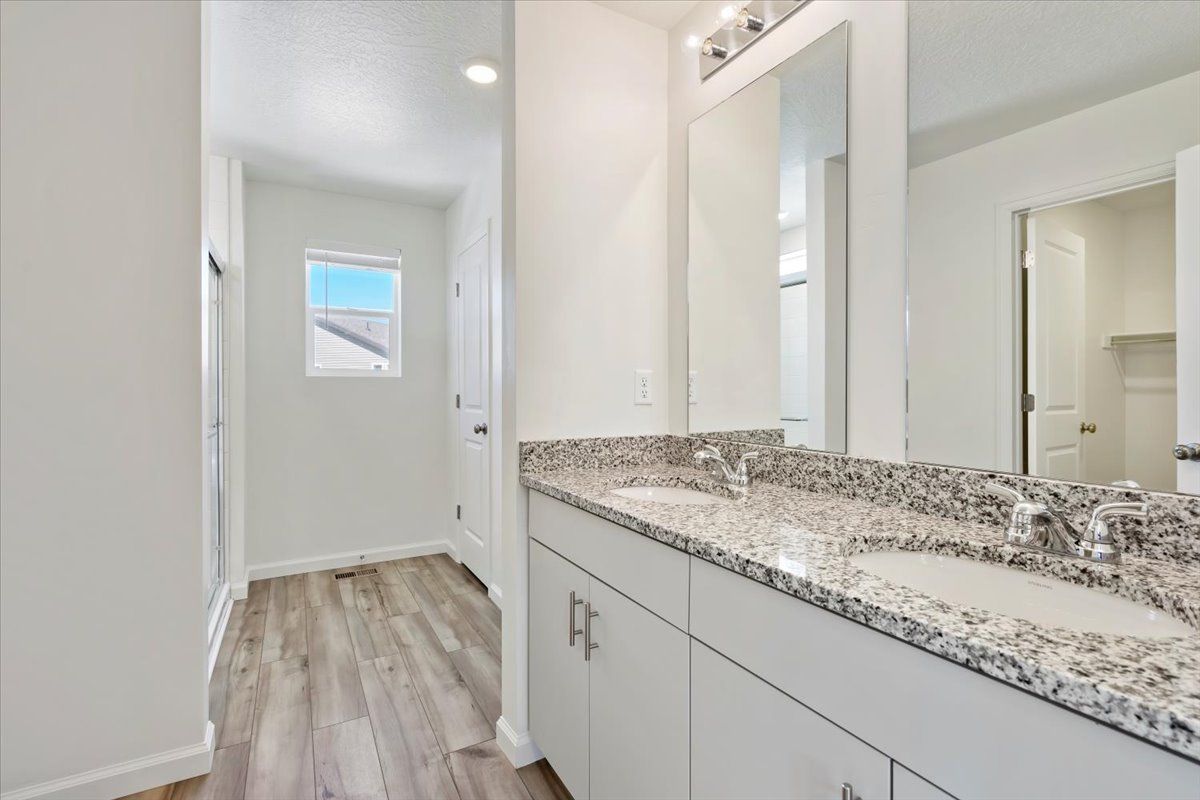 A view of the primary bathroom and vanity