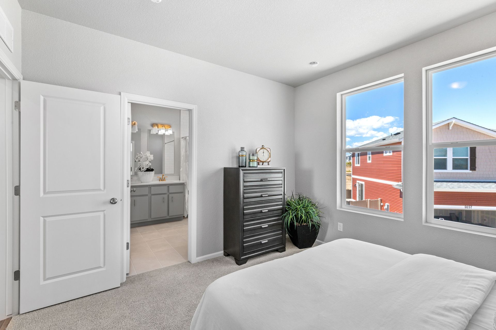 A view of the primary bedroom and entrance to bathroom