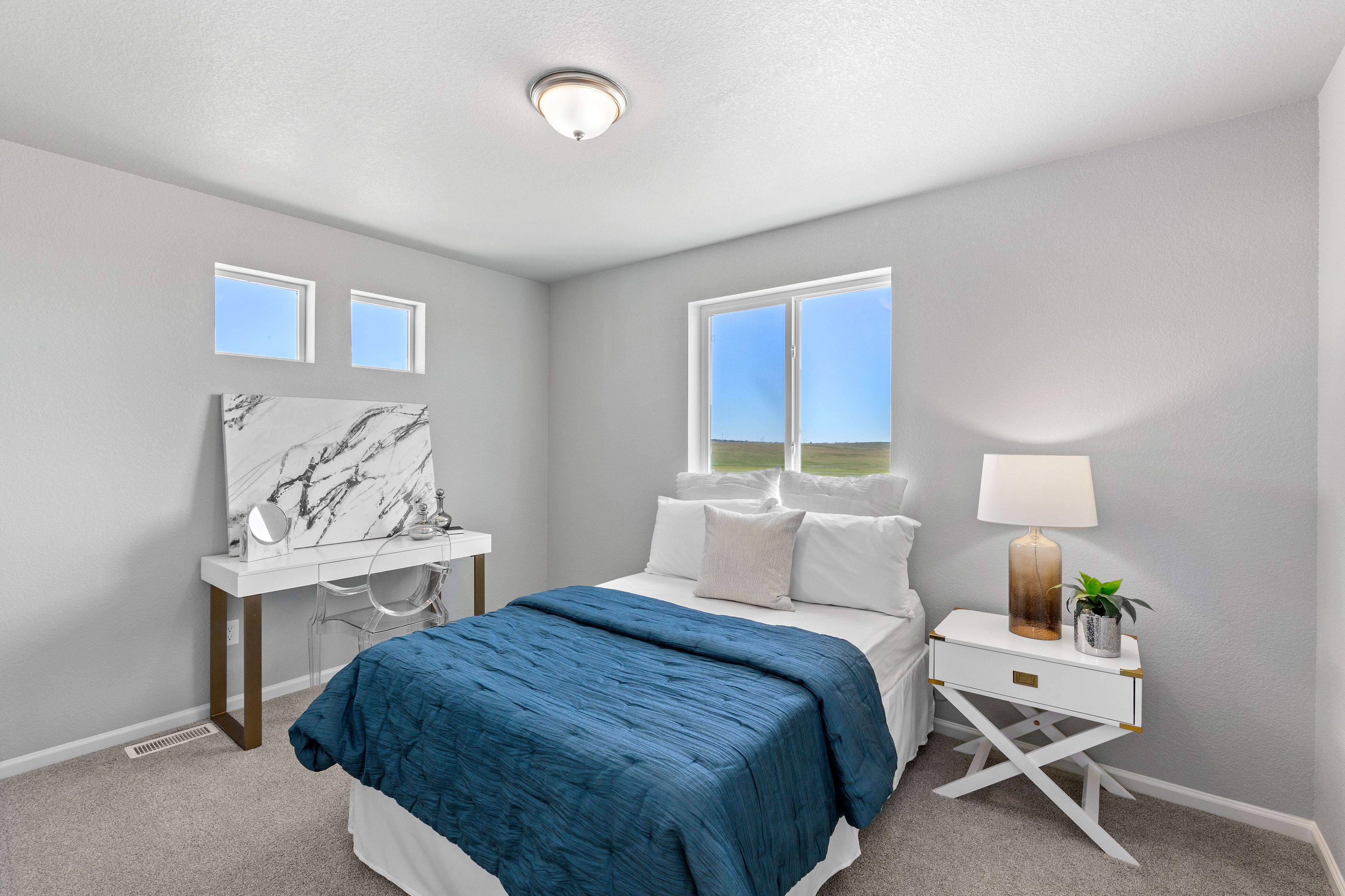 A view of the 2nd bedroom and windows