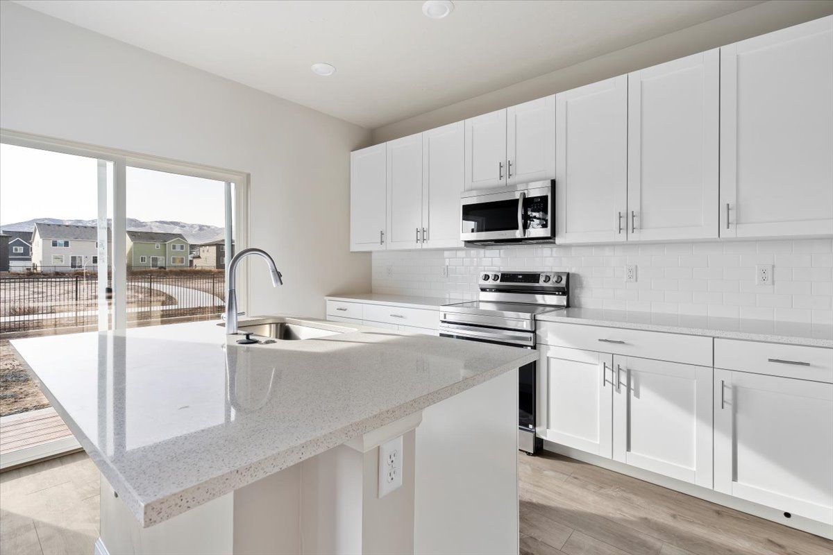 A view of the kitchen and island