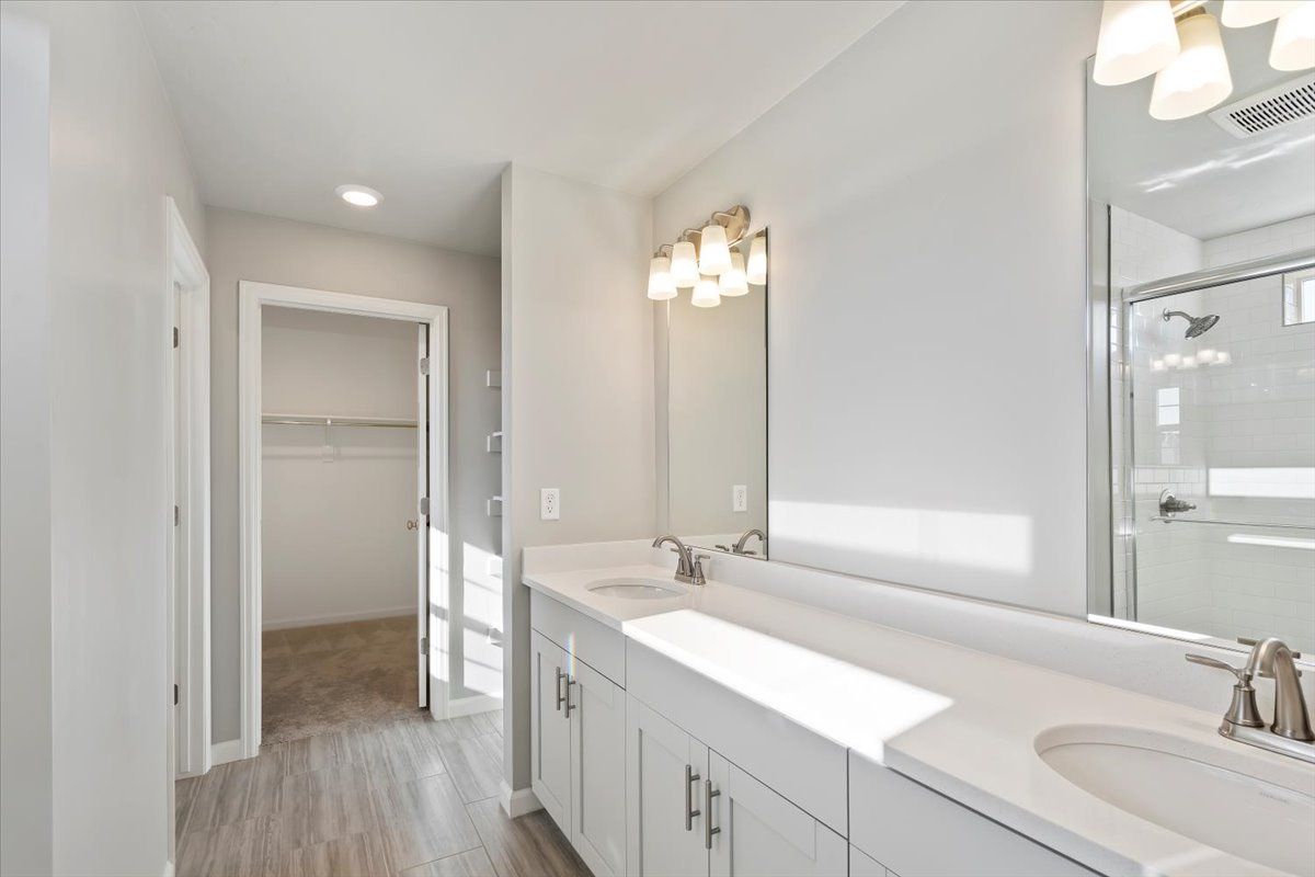 A view of the Primary Bathroom and walk In closet