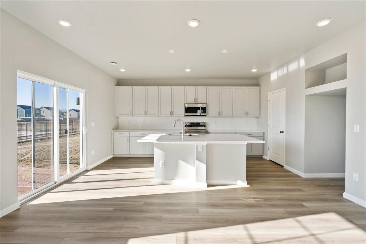 A view of the Kitchen and Island from the Great Room