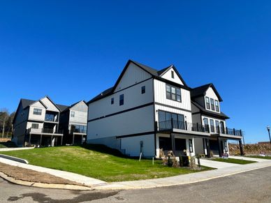 3 story tall buildings with in-law suites on the bottom floor