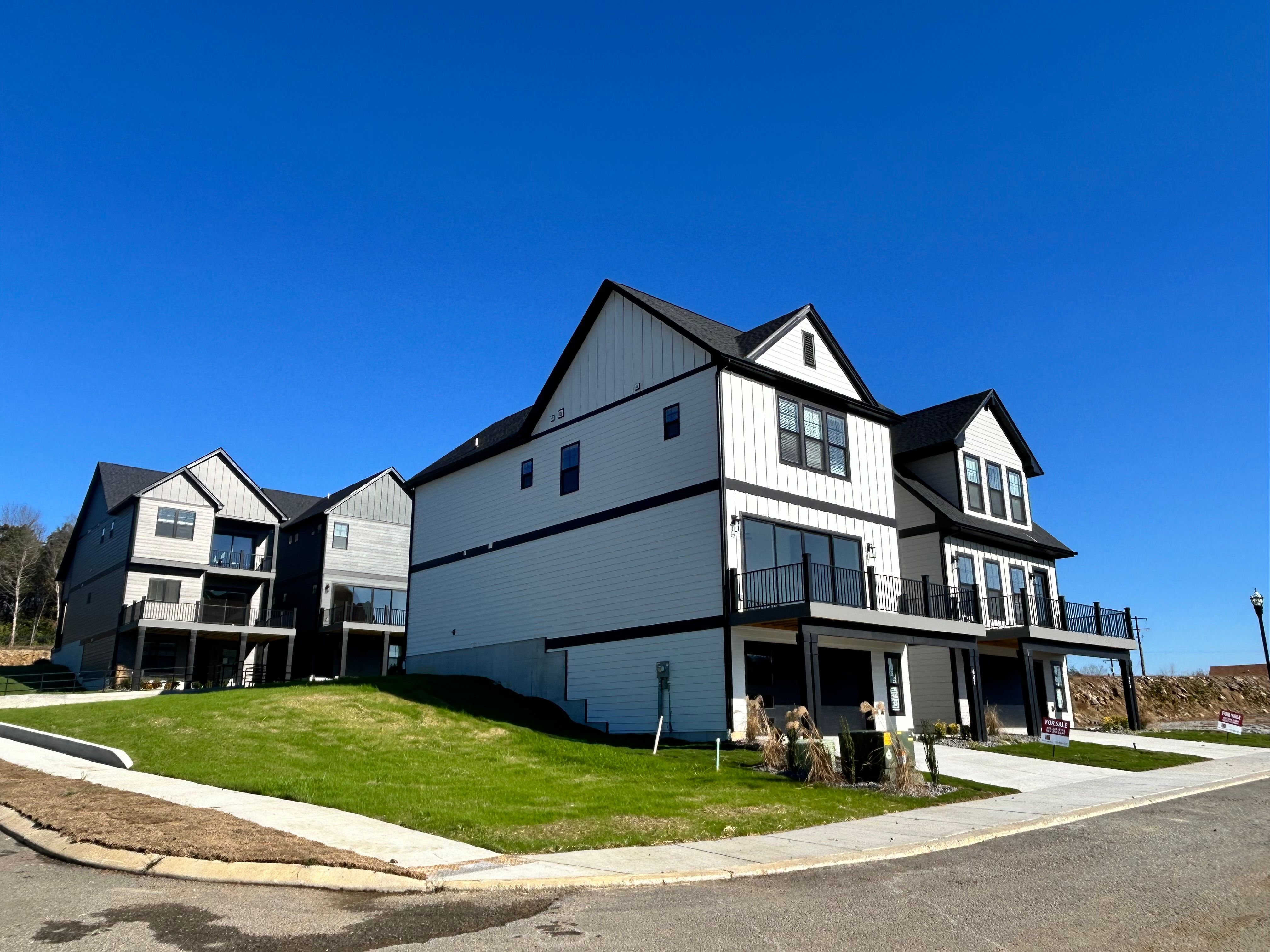 3 story tall buildings with in-law suites on the bottom floor