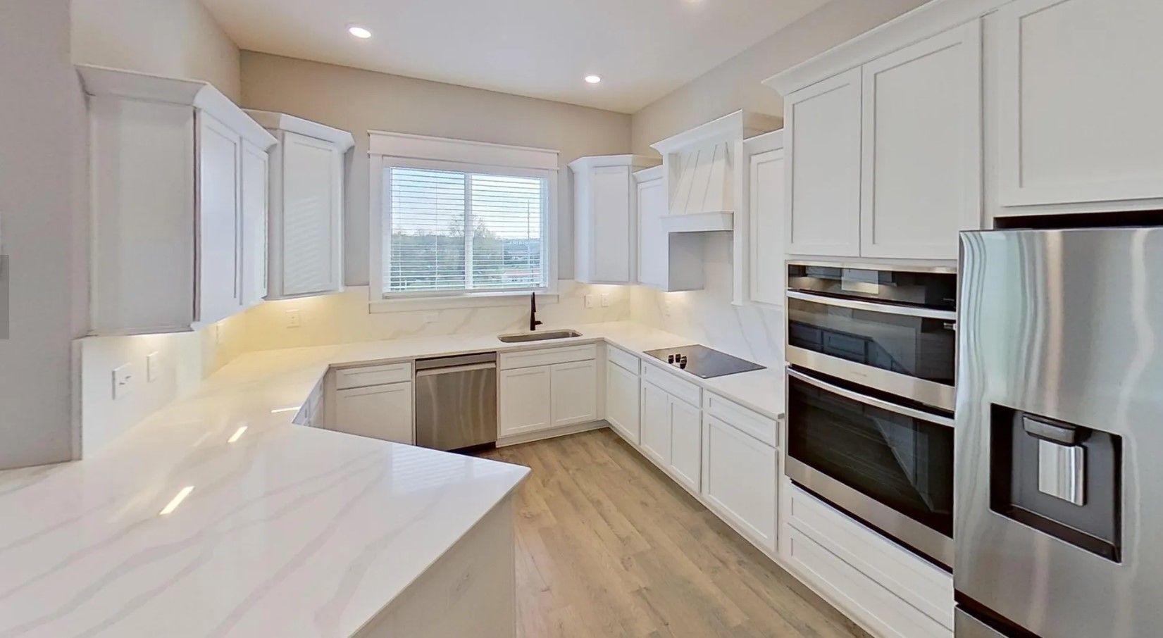 Luxury Kitchens hosting microwave oven and oven, decorative hood vent, included French door refrige