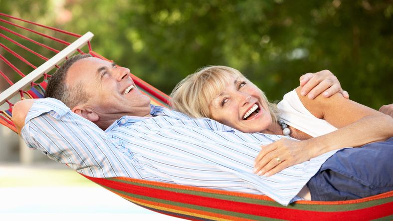 Senior Couple Relaxing In Hammock