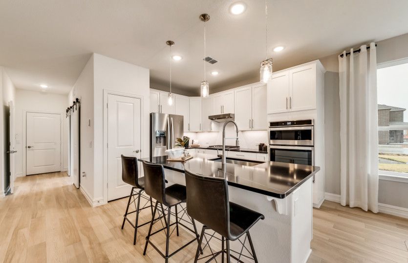 Spacious Island Kitchen with Pendant Lighting