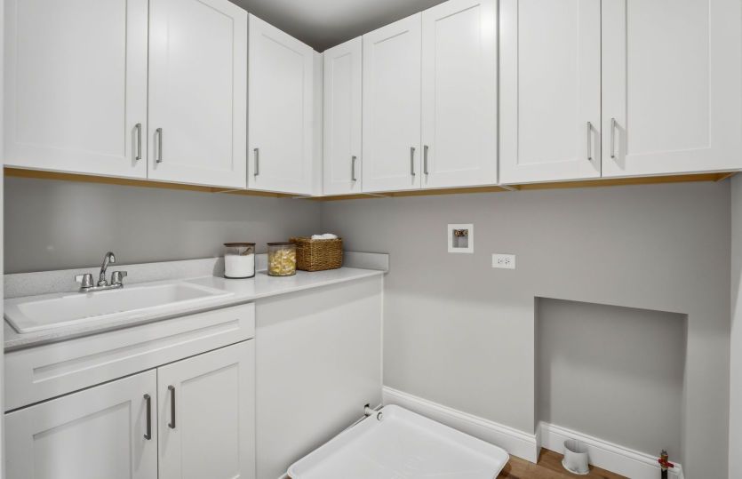 Laundry Room with Shelving and Utility Sink