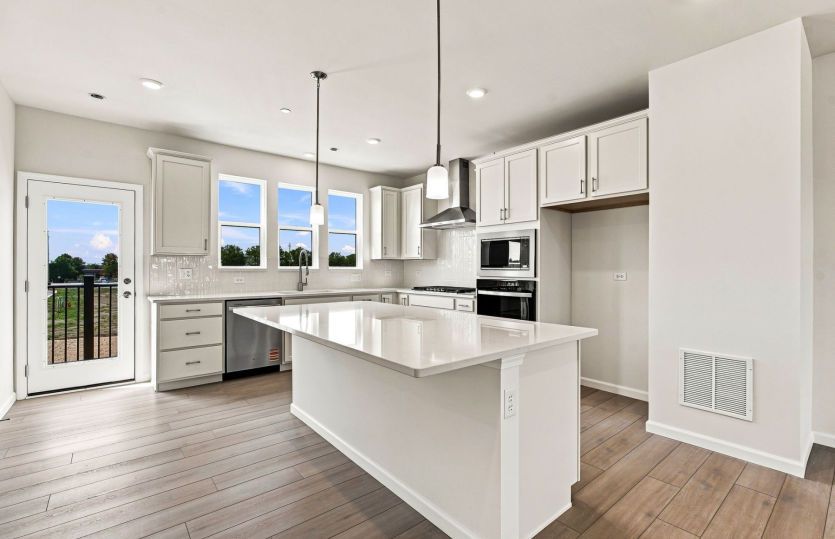 Kitchen with Large Island and Pendant Lighting