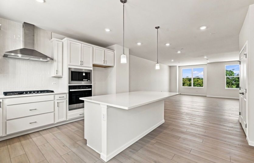 Kitchen with Large Island and Pendant Lighting